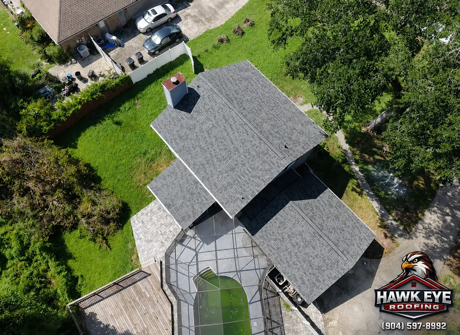 Drone view of a completed architectural shingle roof replacement by Hawk Eye Roofing in Jacksonville, FL